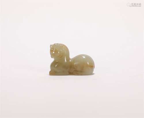 A CHINESE CARVED HETIAN JADE TIGER-SHAPED TALLY
