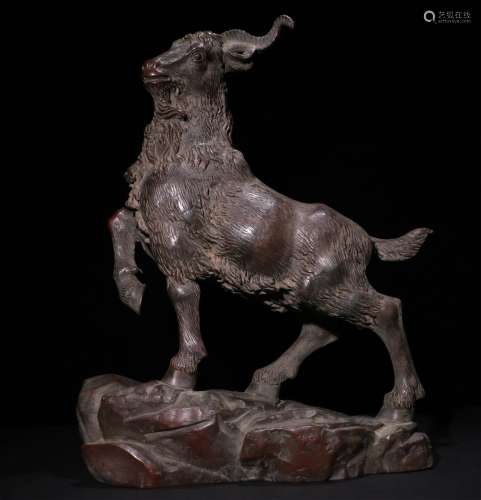 A CHINESE BRONZE GOAT ORNAMENT