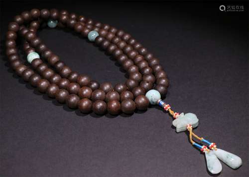 A CHINESE AGARWOOD BUDDHA BEADS STRING