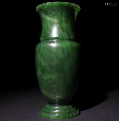 A CHINESE CARVED GREEN JADE VASE