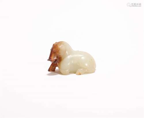 A CHINESE CARVED HETIAN JADE ORNAMENT