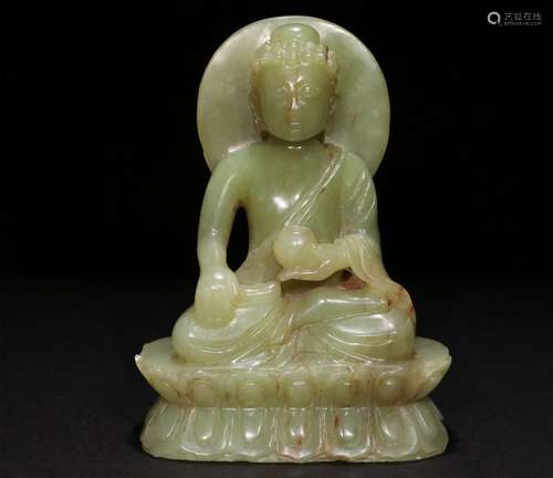 A CHINESE CARVED YELLOW JADE SAKYAMUNI STATUE