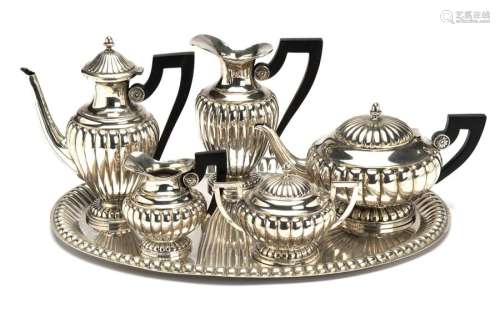 A silver five piece tea service and tray