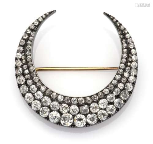 An antique 14k gold and silver diamond crescent br…