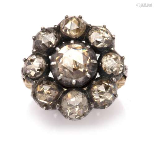 A 14k gold and silver diamond cluster ring