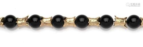A 14k gold onyx sphere necklace