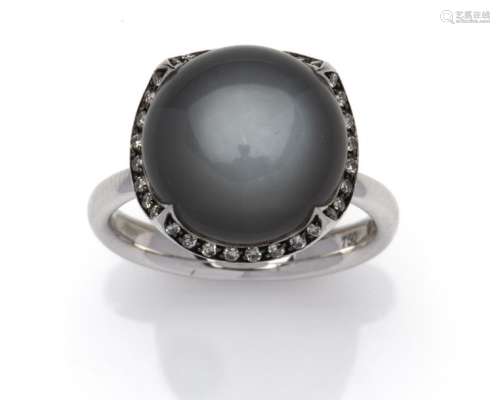 An 18k white gold moonstone and diamond ring