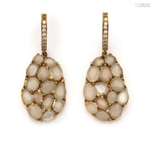 A pair of 18k gold moonstone and diamond earrings