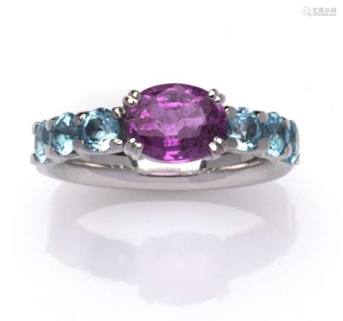 A 14k gold pink sapphire and topaz ring