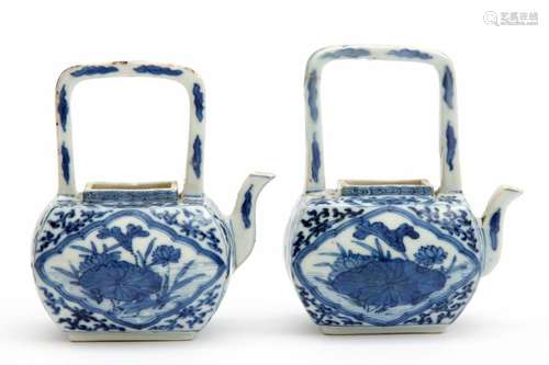 A pair of miniature arch handle teapots