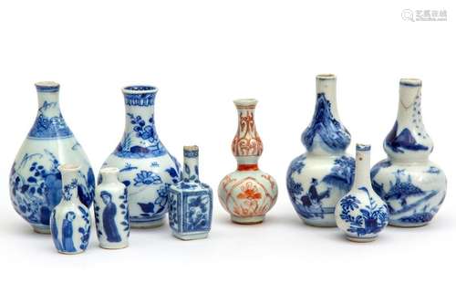 A collection of nine miniature or dolls house vase…