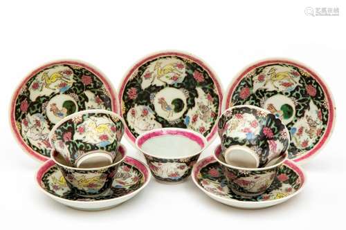 Five famille noire cups and saucers