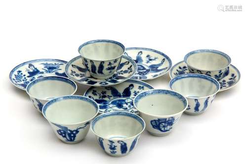 Five blue and white cups and saucers