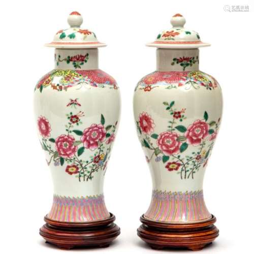 A pair of famille rose floral lidded vases
