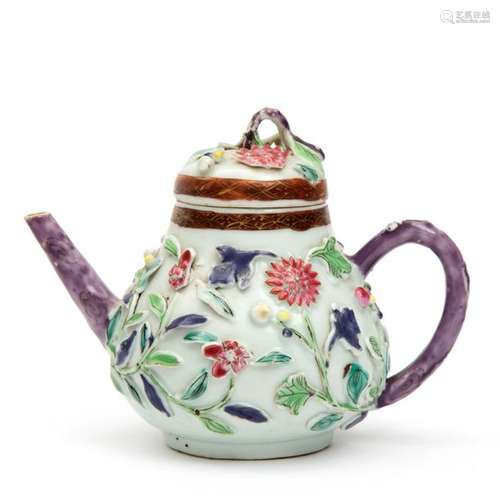 A famille rose teapot with floral aplliques