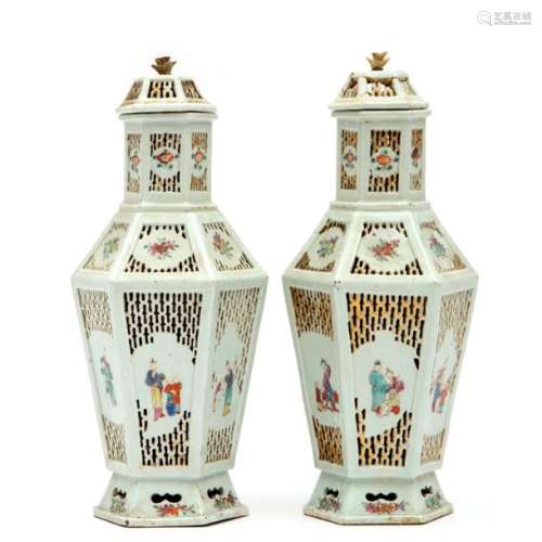 Two famille rose reticulated covered vases