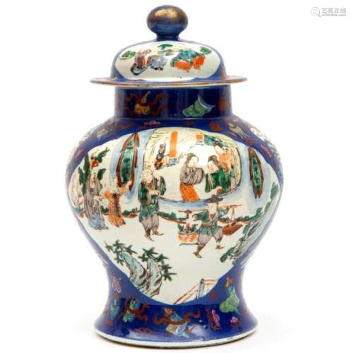 A famille verte covered vase on a blue ground