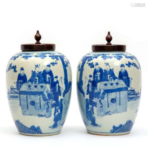 Two blue and white vases with wooden lids