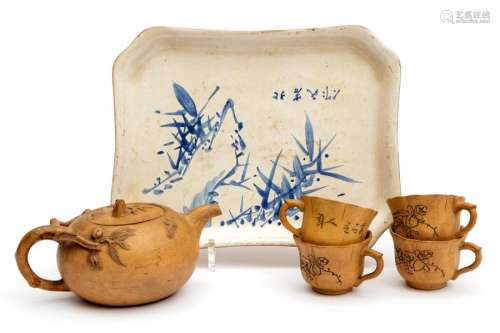 A Yixing pottery teapot, tray and cups