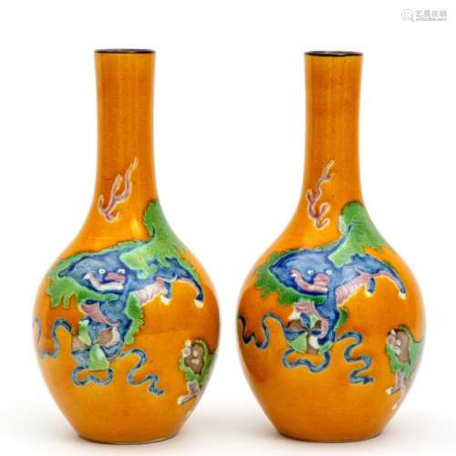Two yellow glaze on biscuit sancai vases