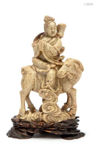 A carved soap stone figure