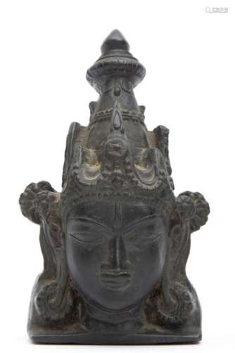 A black stone fragment of Surya