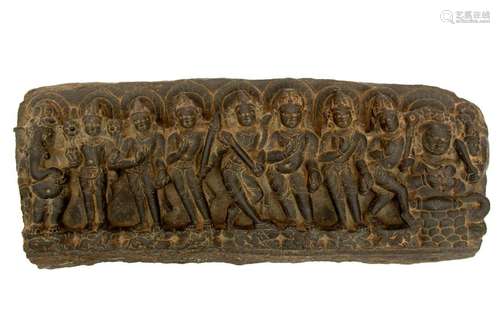 Black stone fragment depicting gods