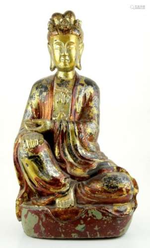 A Chinese polychrome and gilt wood Guanyin