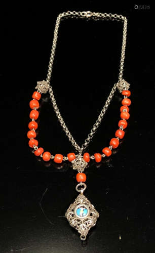 A CORAL STRING AND SILVER NECKLACE