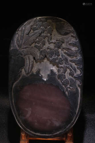 AN INK SLAB CARVED WITH FLOWER