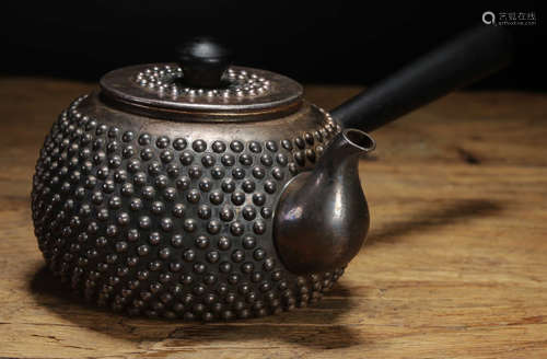 A SILVER POT WITH RIVET