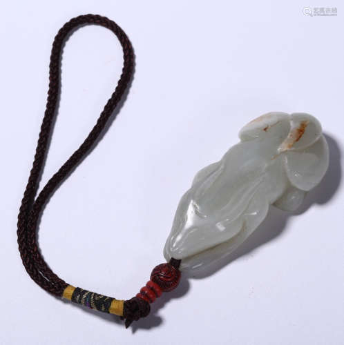 A HETIAN JADE PENDANT SHAPED WITH FOX