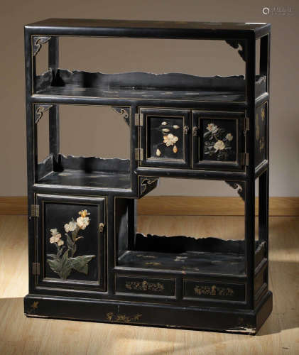 A BLACK LACQUER CARVED TEA SHED