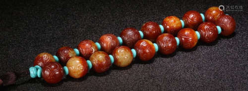 AN ANTIQUE JADE STRING BRACELET WITH 18 BEADS