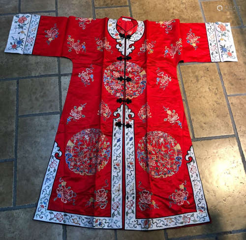 A RED ROBE WITH FLOWER PATTERN