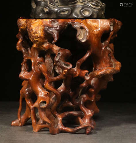 A HUANGYANG WOOD BASE WITH NATURE SHAPED