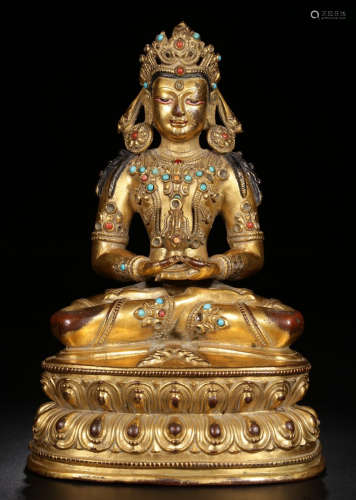 A GILT BRONZE BUDDHA STATUE EMBEDDED WITH AGATE
