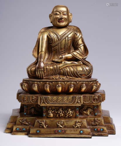 A GILT BRONZE BUDDHA STATUE EMBEDDED WITH AGATE
