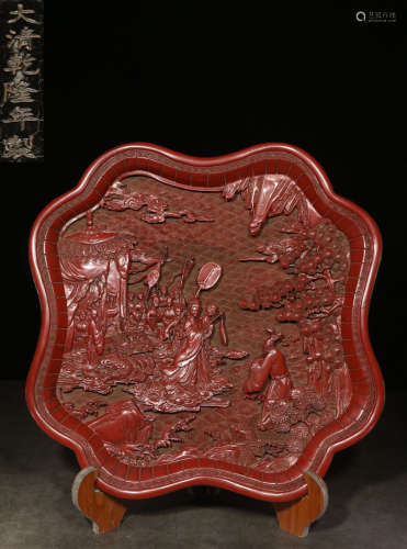 A RED LACQUER PLATE CARVED WITH STORY