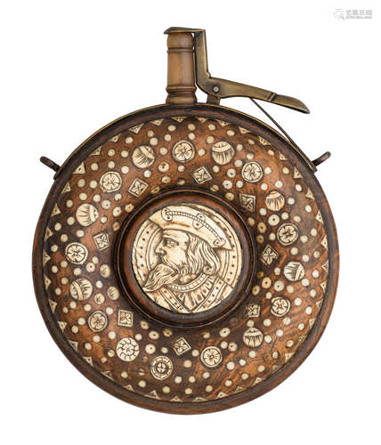 A DECORATED CIRCULAR POWDER-FLASK IN GERMAN 17TH CENTURY STYLE