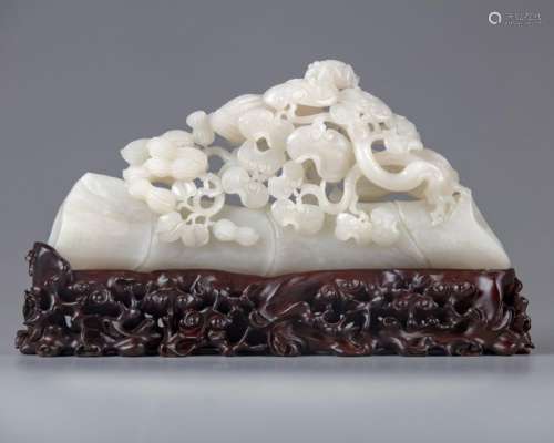 A CHINESE PALE JADE CARVING OF BAMBOO AND PEANUTS,…