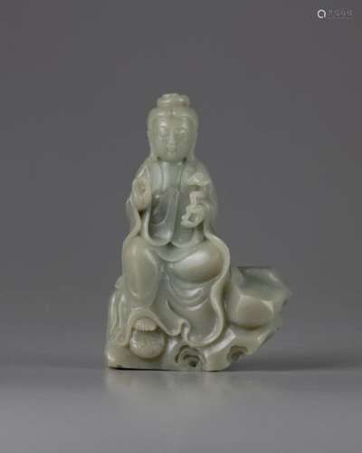 A CHINESE CELADON JADE CARVING OF A GUANYIN, CHINA…