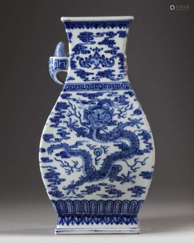 A CHINESE BLUE AND WHITE 'DRAGON AND PHOENIX' VASE…