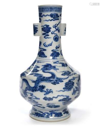 A CHINESE BLUE AND WHITE DRAGONS BOTTLE VASE, CHIN…