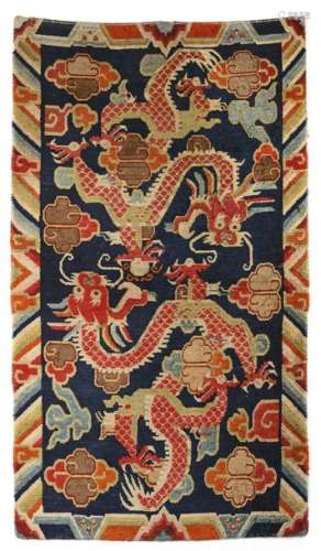 A TIBETAN DRAGON WOOl RUG, TIBET, CIRCA 1900