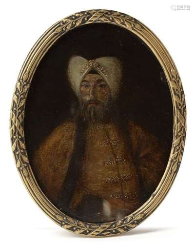 AN OTTOMAN OVAL SHAPED PORTRAIT OF A PASHA, 19TH C…