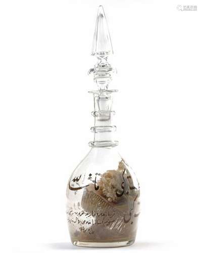 A TRANSPARENT GLASS SUFI CARAFE, TURKEY, DATED 130…