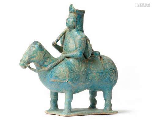 A KASHAN UNDERGLAZE DECORATED FIGURE OF A HORSE AN…