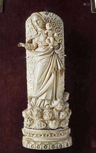 AN INDO PORTUGUESE CARVED IVORY FIGURE OF THE MADO…