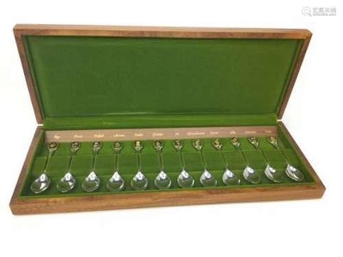 A SET OF TWELVE ROYAL HORTICULTURAL SOCIETY SILVER SPOONS